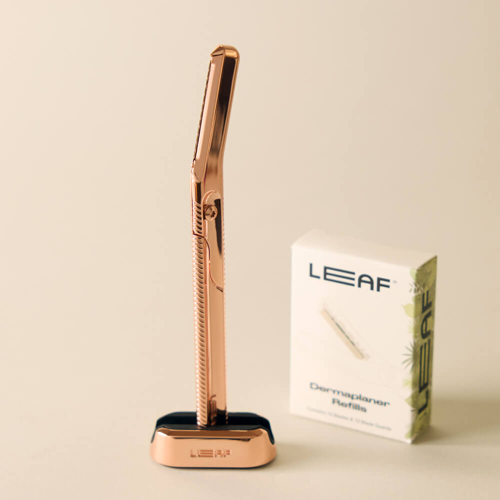 The rose gold dermaplaner kit with the dermaplaner and refills