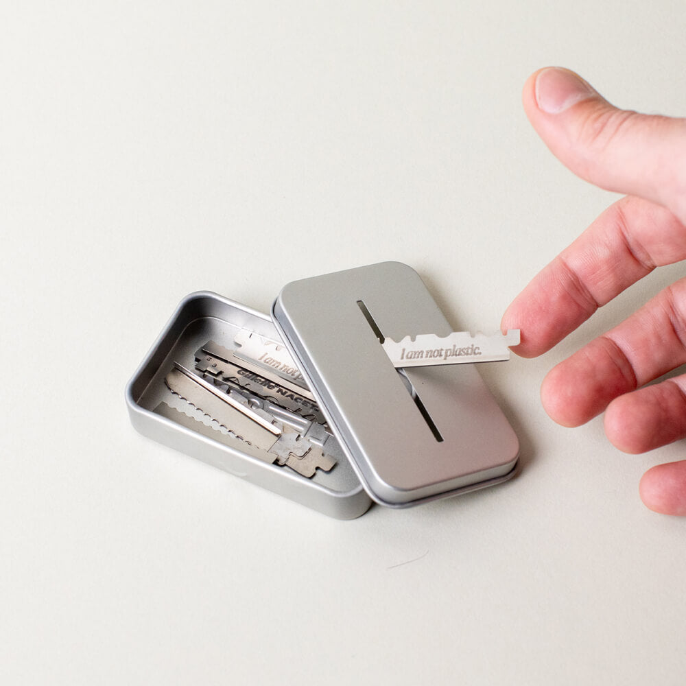 User puts blade through recycling tin while the lid is off