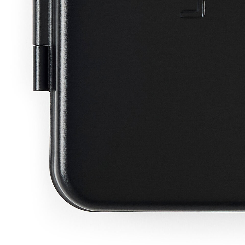 The corner of a black single edge razor case closeup