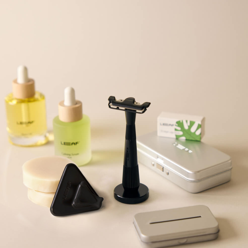 The black single edge everything bundle with the single edge razor, stand, blades, case, recycling tin, shave oil, calming serum, shave soap bar, and shower holder